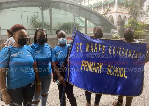 SUCCESSFUL: Parents of students of St Mary's Government Primary School in Moruga, outside the Ministry of Education in Port of Spain on Monday where they queried the results of the Junior Panorama Finals which had their children's school placing tenth and last.