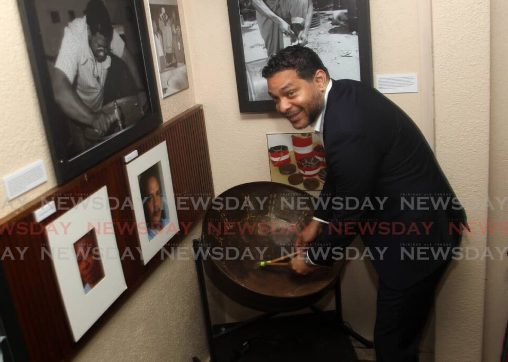 Randall Mitchell, Tourism and Arts Minister plays the steelpan at the launch of the Carnival Museum, on July 27, 2022.