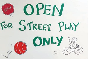 Open for Street Play Only: A sign designed by volunteers for the Mass. Ave. Coalition’s second annual festival coming Sept. 17 to Chester Square.