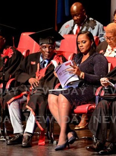 UTT honorary doctoral awardee of fine arts; Bertrand Kelman (left), (and a member of his family)