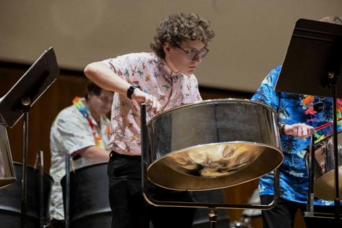 Lane Bibb looks at his sheet music while he plays the steel drum during WKU’s Steelband concert at FAC on Wednesday, Nov. 19, 2025.