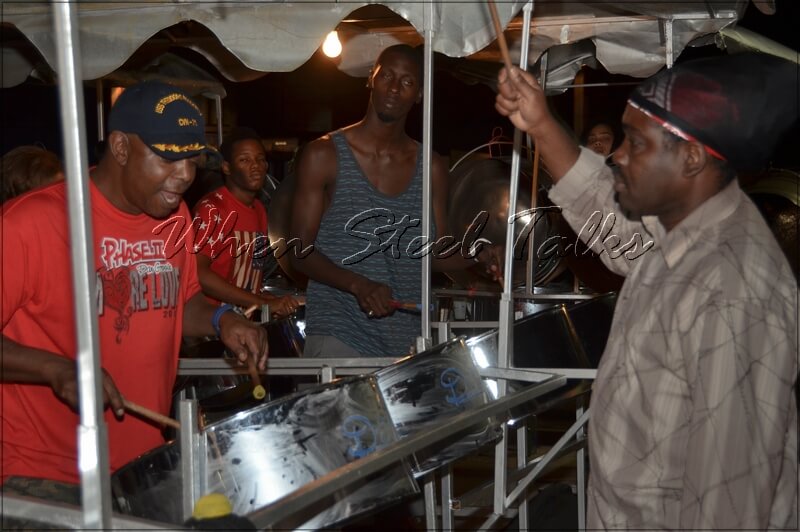 Patrick Davis, right, guiding D’Radoes Steel Orchestra during rehearsals for New York’s annual Panorama