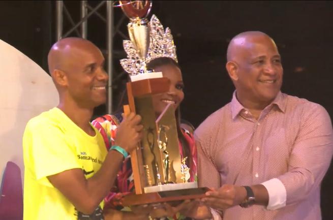 Left to right: Champion Babonneau Steel Orchestra arranger Allison Marquis, National Carnival Queen 2023 Shanice Butcher (partially hidden), and Dr. Ernest Hilaire, Minister for Tourism, Investment, Creative Industries, Culture and Information