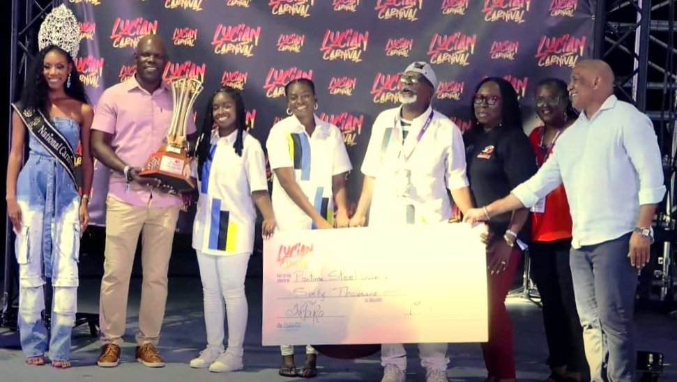 Pantime’s manager and leader Cecil “Tortee” Philgence (fourth from right) is happy during the presentation of the championship trophy, check and prize tenor pan for the 2025 Saint Lucia Panorama