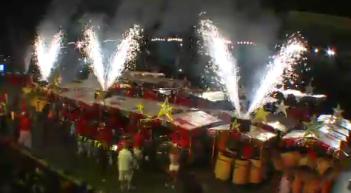 Trinidad All Stars Steel Orchestra complete their performance with fireworks with 'Vs' for Victory