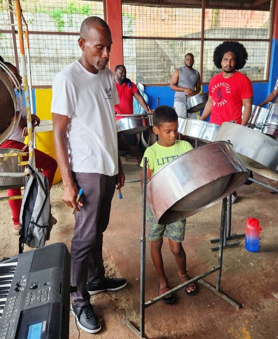 Drill Master Andre Robley takes this young tenor player through the paces