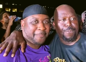Arrangers Al Foster and Rudo Forteau share an embrace after results were announced at Pan Alive 2026